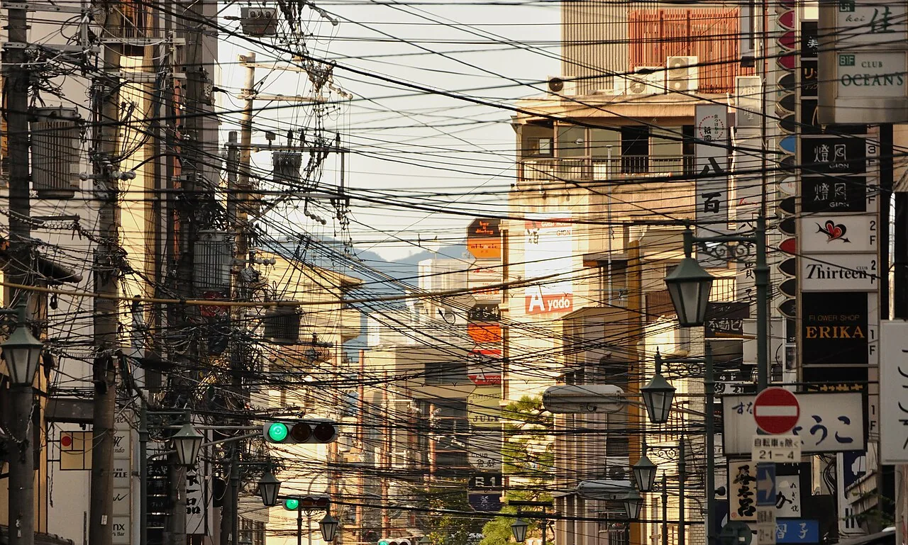 Dense overhead electric wires above a street in Japan