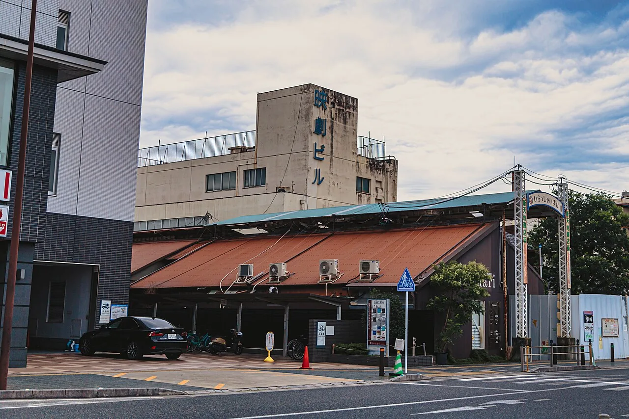 A shopping arcade entrance in Iga, Mie Prefecture, with an older cinema building behind