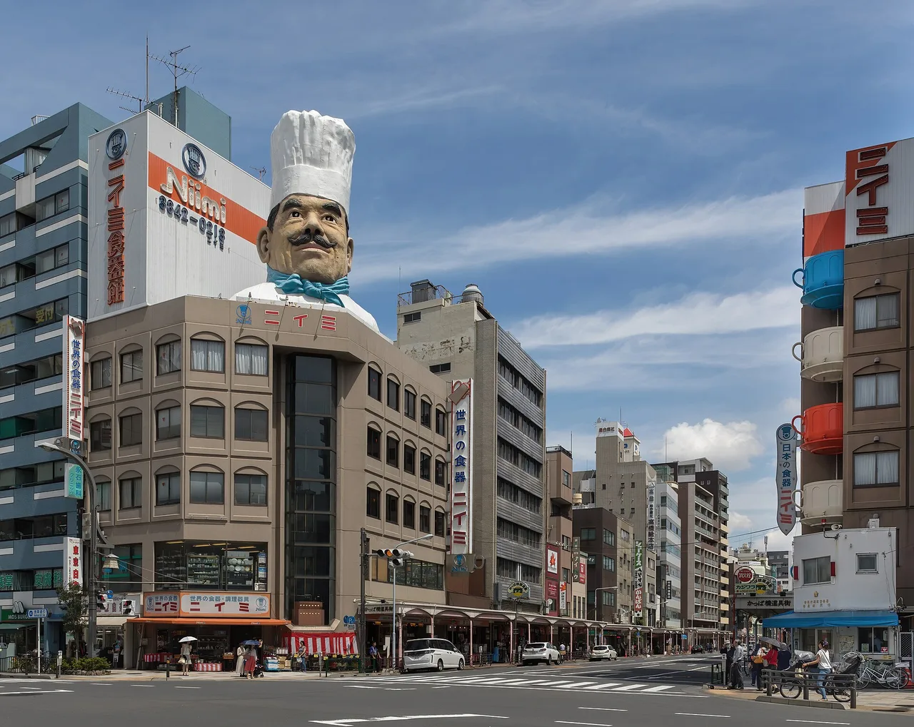 Kappabashi-dori kitchenware street with the Niimi chef head, Asakusa, Tokyo, Japan