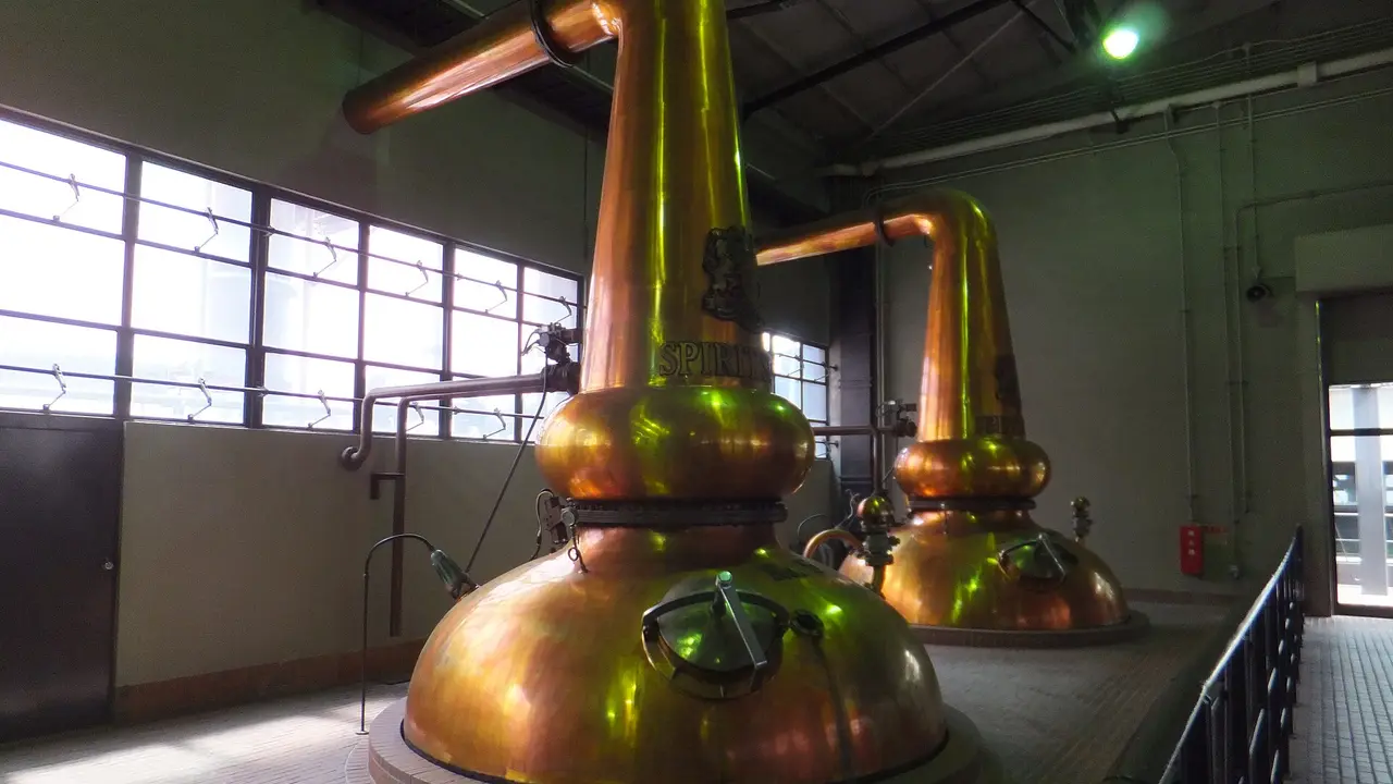 Copper pot stills in the still house at the Yamazaki Distillery, Osaka, Japan